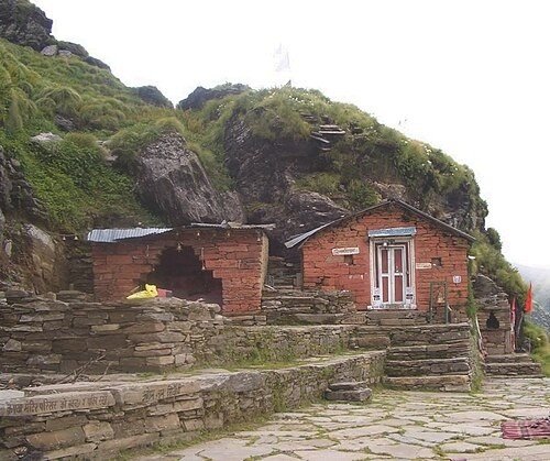 Rudranath Temple surrounded by alpine meadows and Himalayan peaks, Chamoli, Uttarakhand — second Kedar where Lord Shiva's face is worshipped