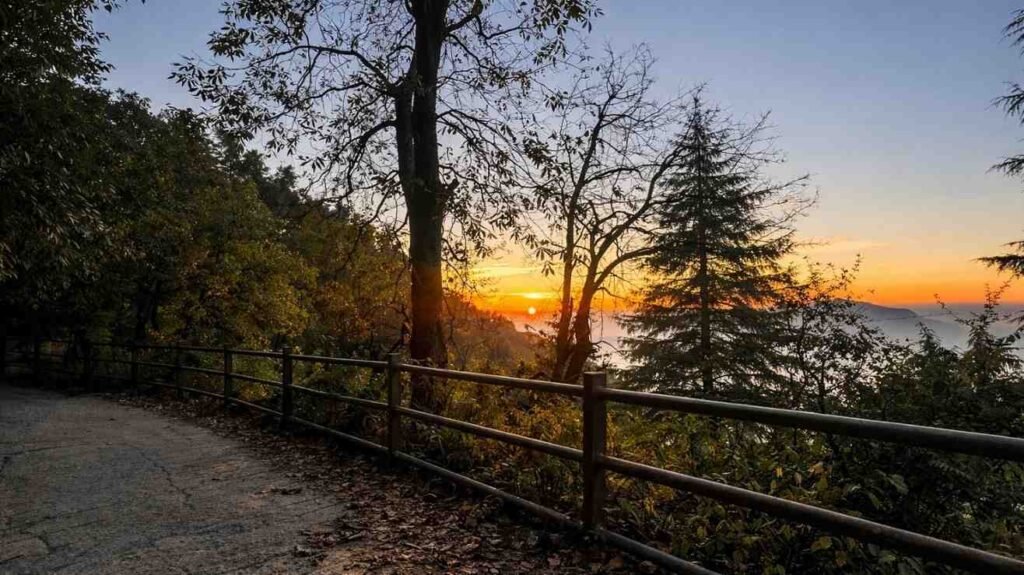 Winter sunset over Shivalik Hills Dehradun with Himalayan peaks visible in background — best season October to February for clear sky sunsets